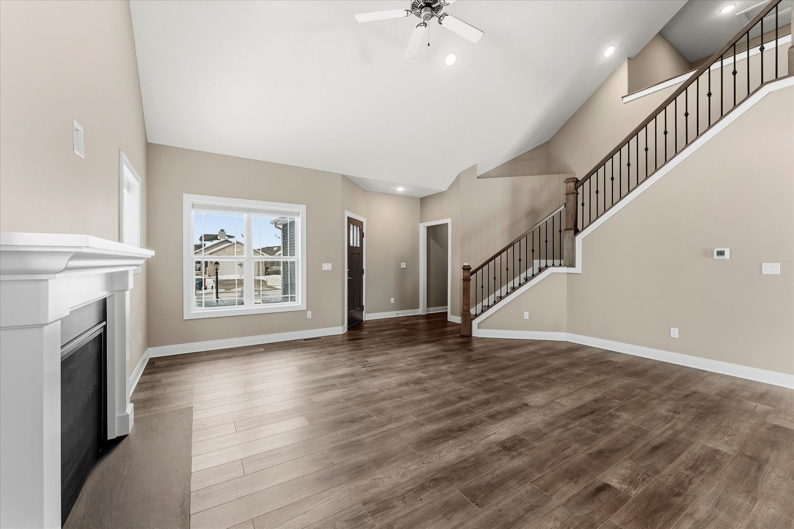 3411 Boulder Ridge Drive Champaign, IL 61822 - Photo 5 of 36 a view of an empty room with wooden floor and a window