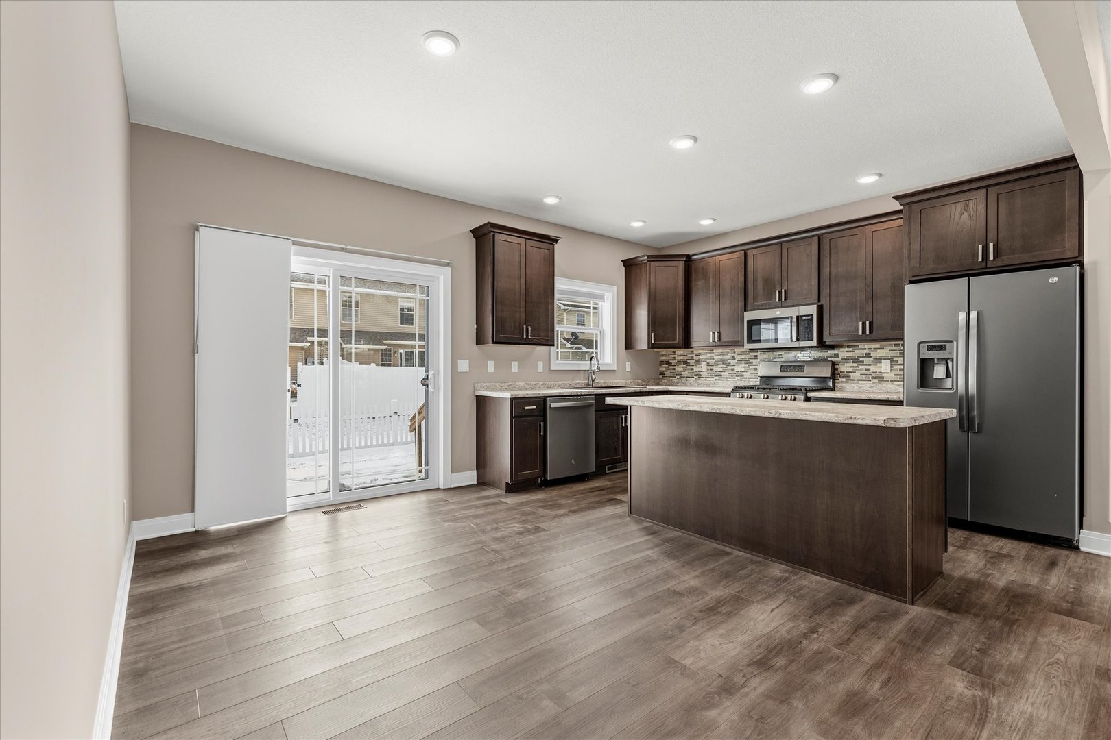 3411 Boulder Ridge Drive Champaign, IL 61822 - Photo 8 of 36 a kitchen with stainless steel appliances granite countertop a refrigerator sink and cabinets