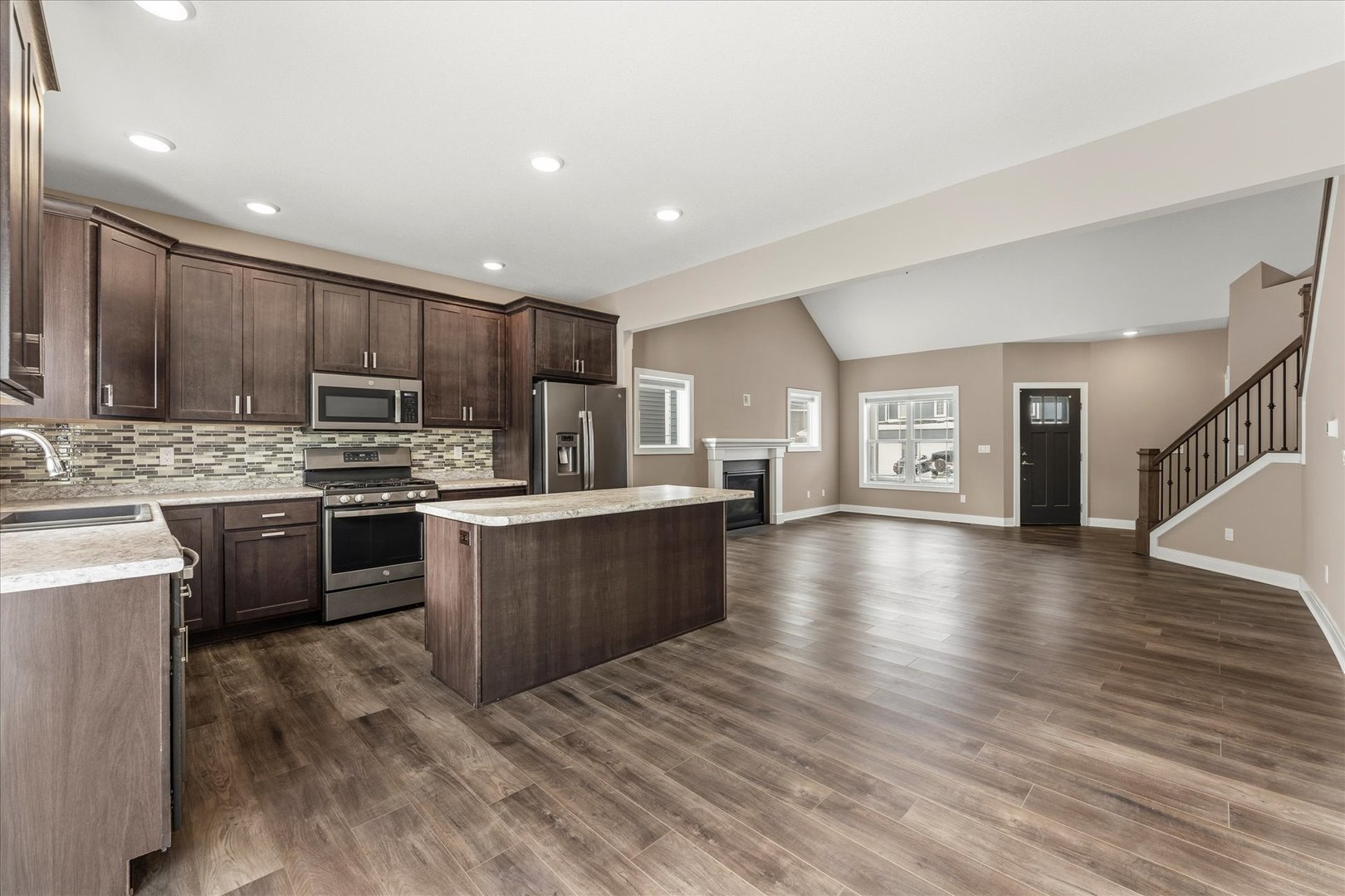 3411 Boulder Ridge Drive Champaign, IL 61822 - Photo 9 of 36 a kitchen with a refrigerator and a microwave