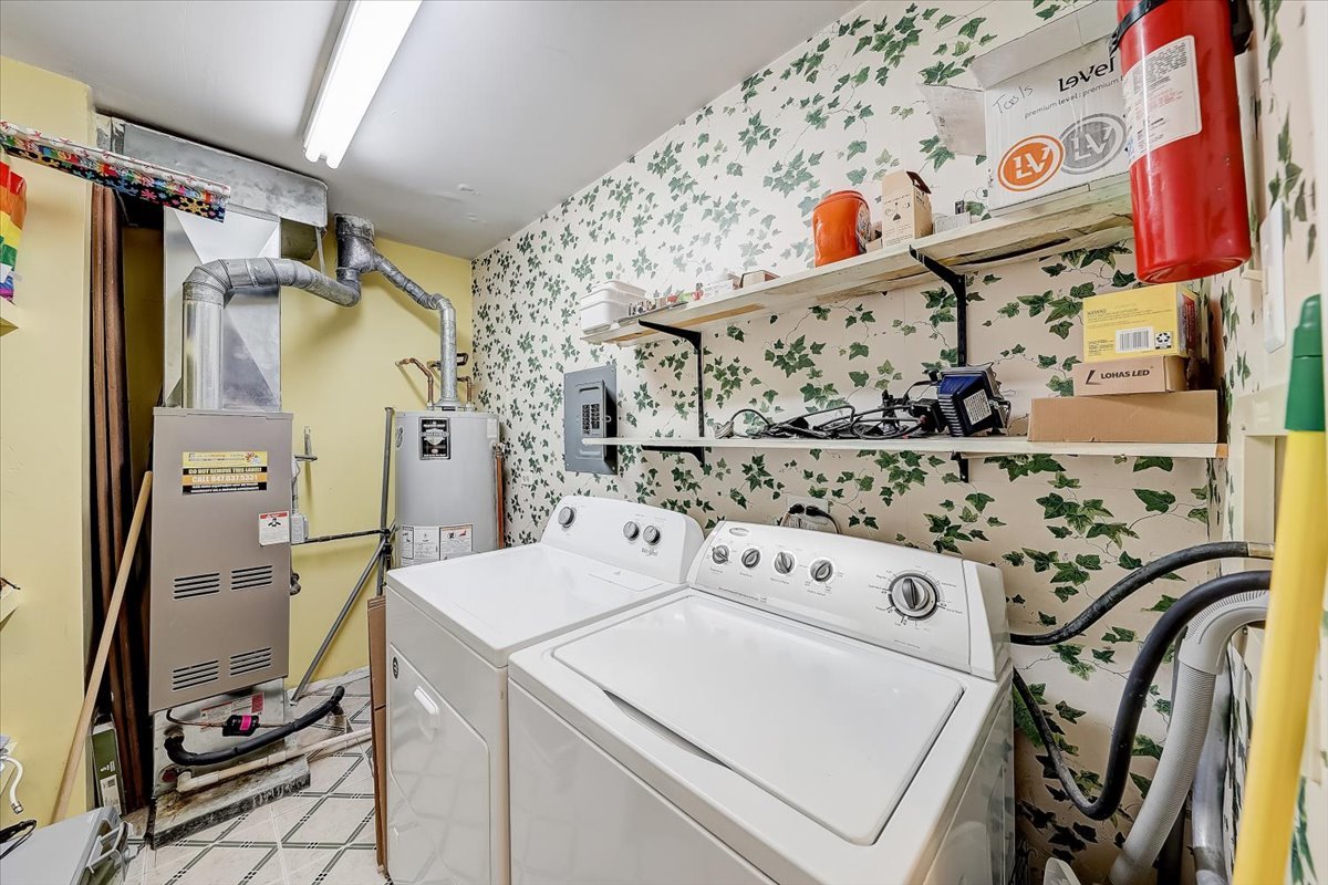 1110 Scanlon Drive, Unit D1 Wheeling, IL 60090 - Photo 13 of 23 a utility room with dryer and washer
