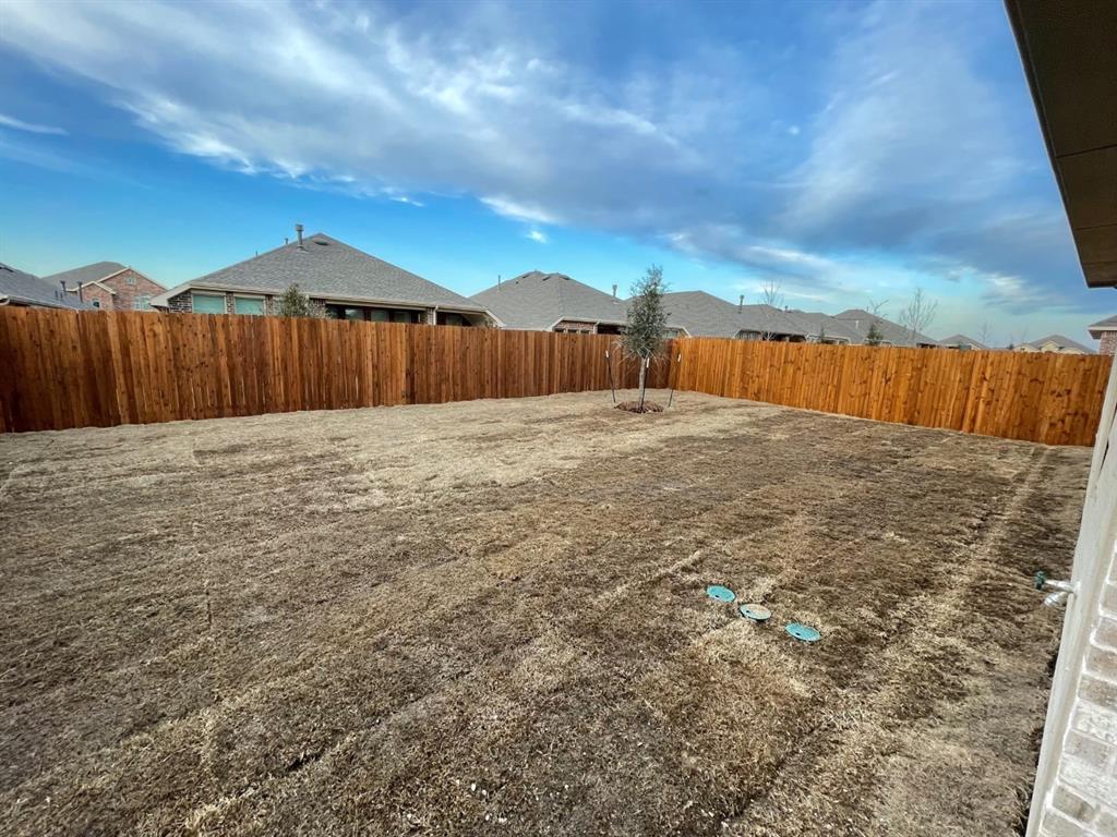 3700 Milkweed Road McKinney, TX 75071 - Photo 18 of 18 Expansive backyard featuring a new wood privacy fence