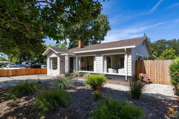 a front view of a house with garden
