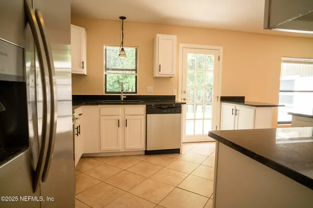 a view of a bathroom from a hallway