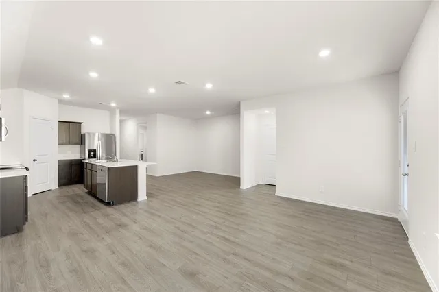 a view of a backyard with plants and a big yard