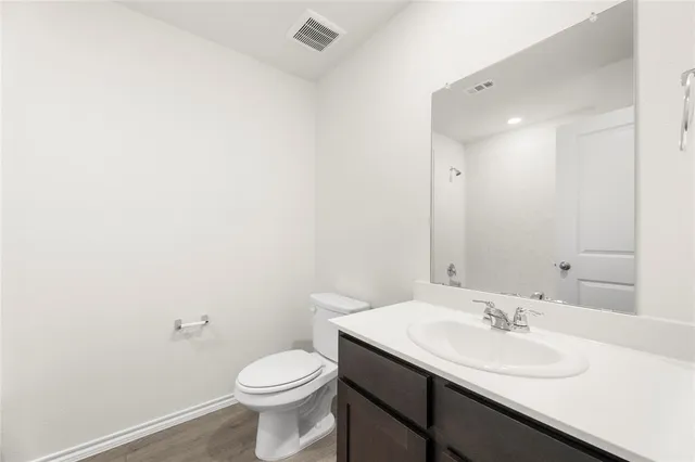 a view of kitchen with sink and wooden floor