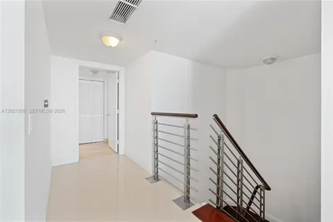 a view of a hallway with staircase