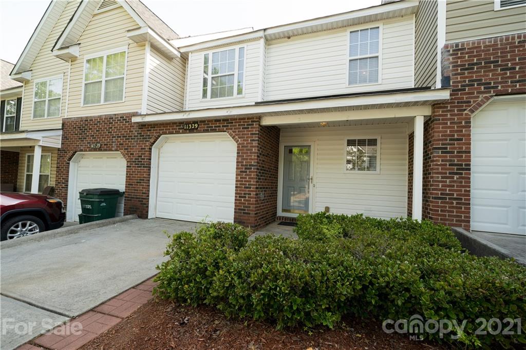 11329 Stone Trail Road Charlotte, NC 28213 - Photo 2 of 23 a front view of a house with a yard