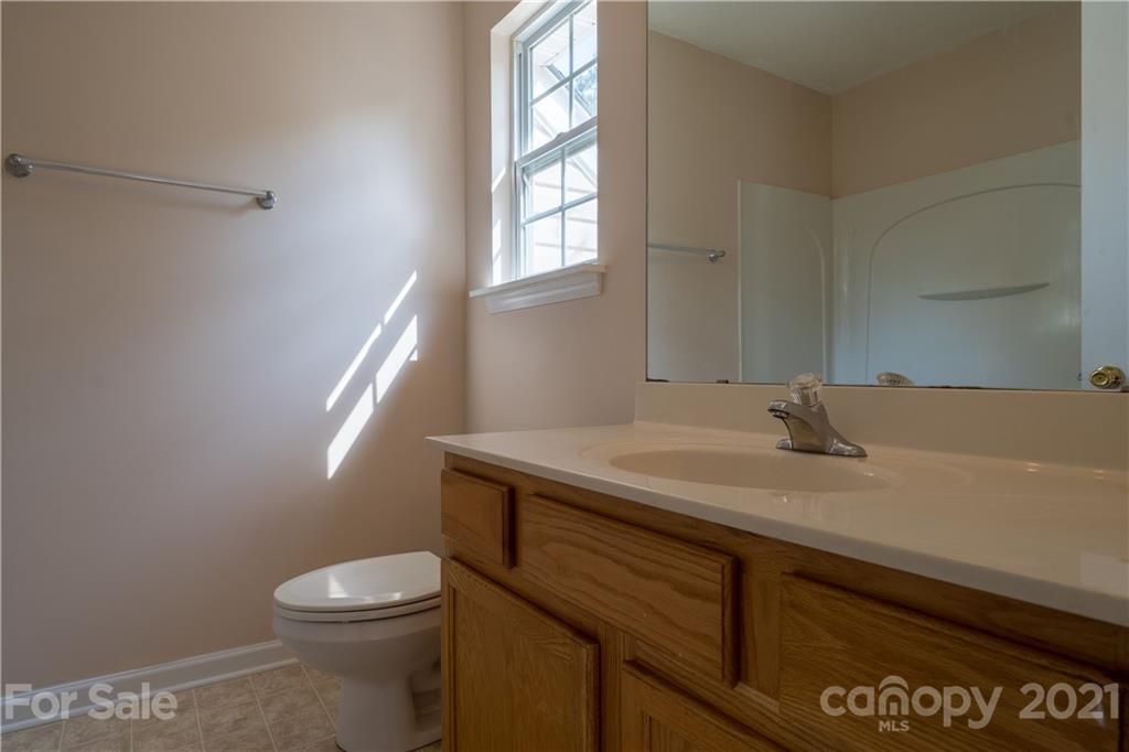 11329 Stone Trail Road Charlotte, NC 28213 - Photo 20 of 23 a bathroom with a granite countertop sink toilet and a mirror
