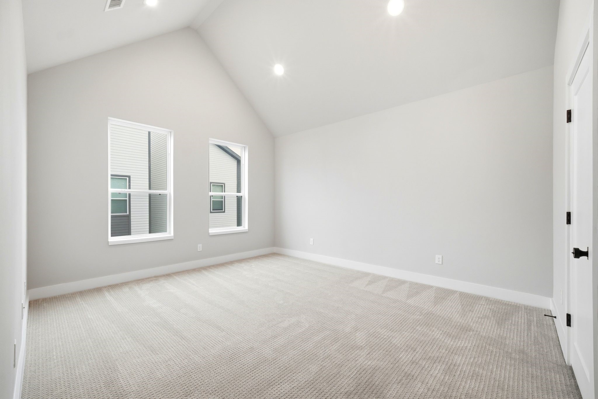 5814 Cebra Street Houston, TX 77091 - Photo 18 of 32 Spacious primary bedroom with vaulted ceilings and abundant natural light.