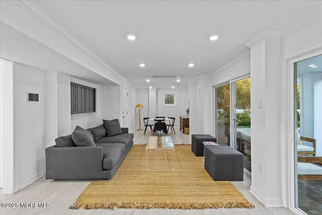 a living room with furniture and a rug