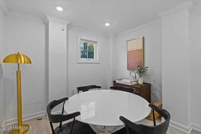 a dining room with table and chairs