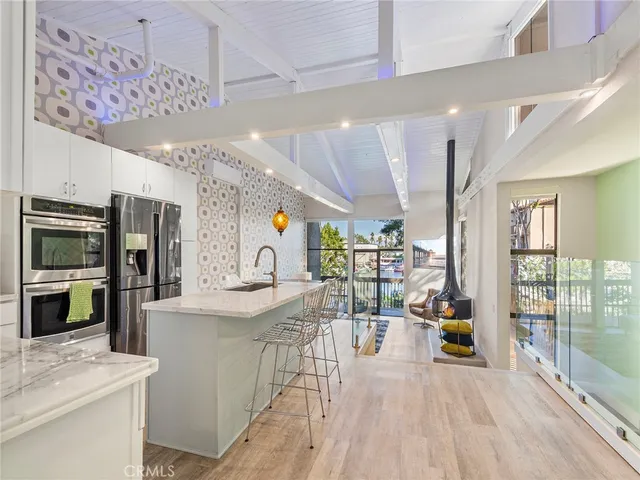 a spacious bathroom with a sink a mirror and shower
