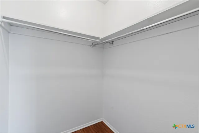 a view of a room with shelf on the wall