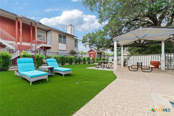 a garden view with a seating space