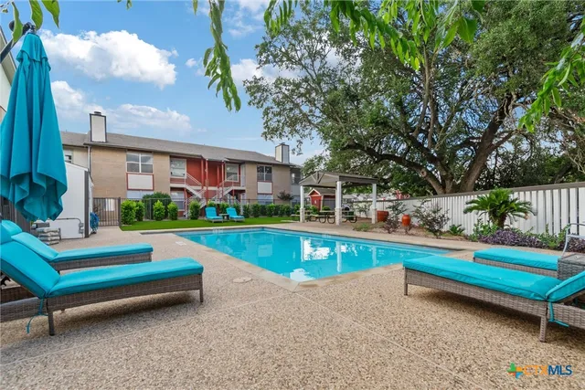 a park view with a bench and garden