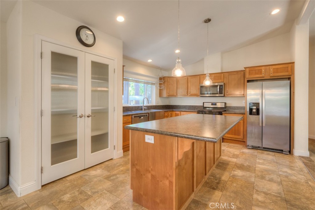 14565 Coutolenc Road Magalia, CA 95954 - Photo 5 of 43 a kitchen with stainless steel appliances granite countertop a refrigerator and a sink