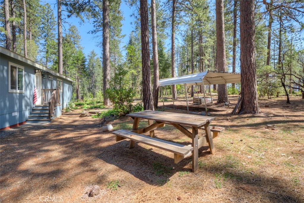 14565 Coutolenc Road Magalia, CA 95954 - Photo 10 of 43 a view of a house with backyard and sitting area