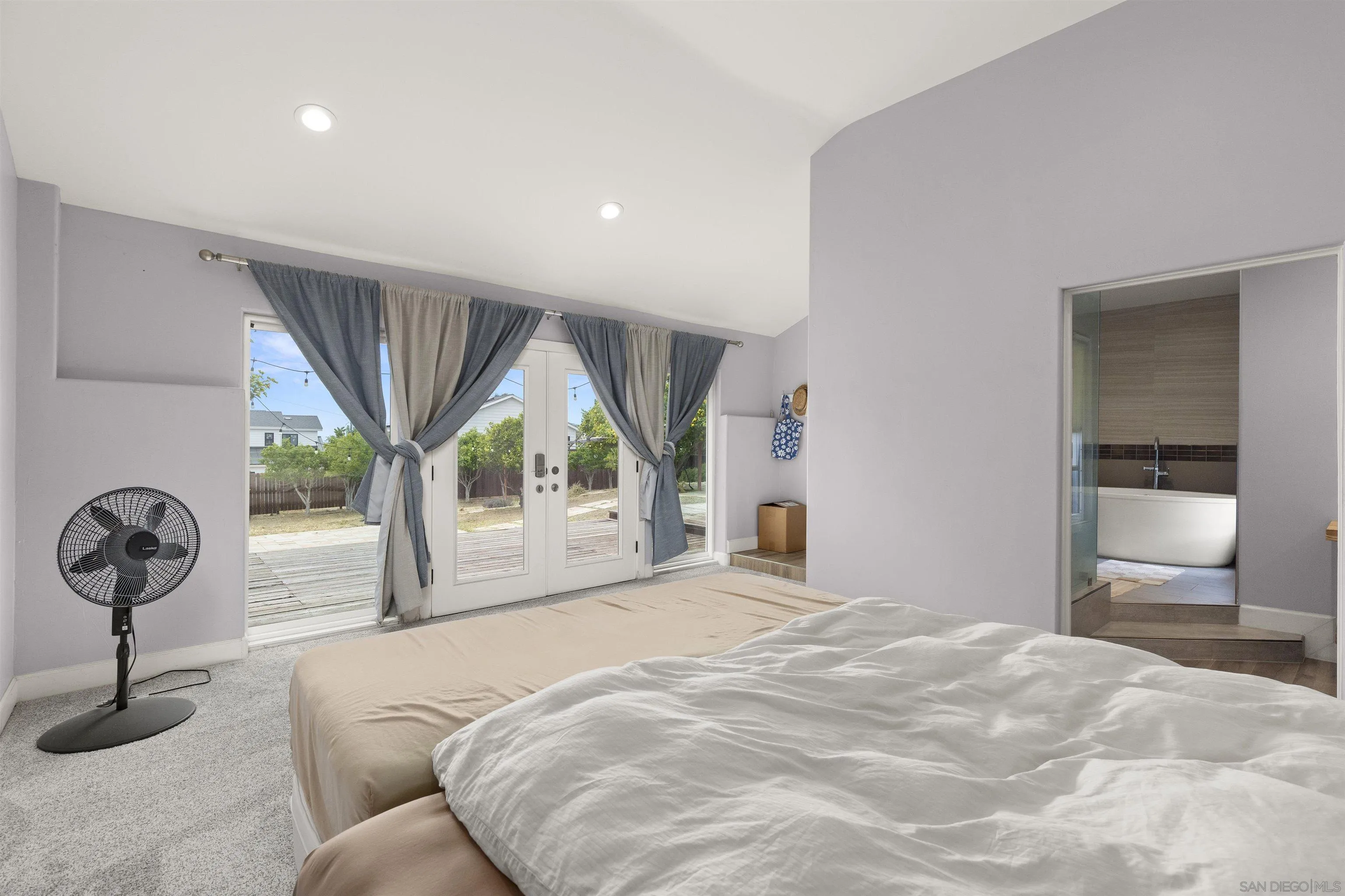 752 Bracero Road Encinitas, CA 92024 - Photo 20 of 46 a bedroom with a bed and a large window