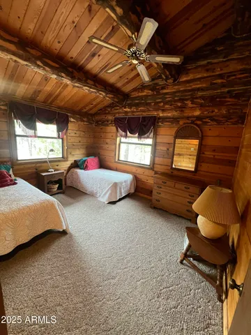 a bedroom with bed and window