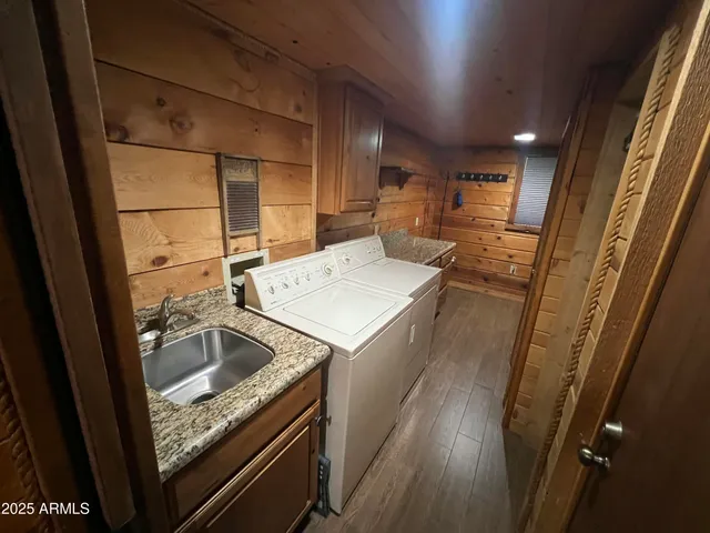 a kitchen with a sink and refrigerator