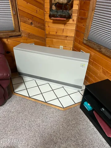 a view of a room with wooden floor and stairs