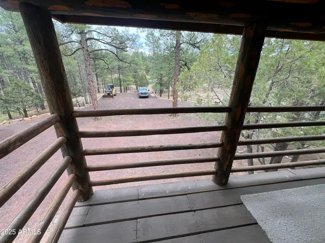 a view of a porch with wooden floor