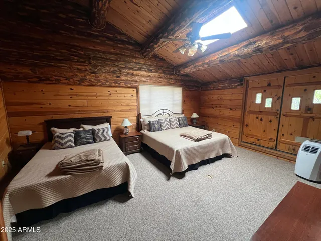 a bedroom with bed and a walk in closet