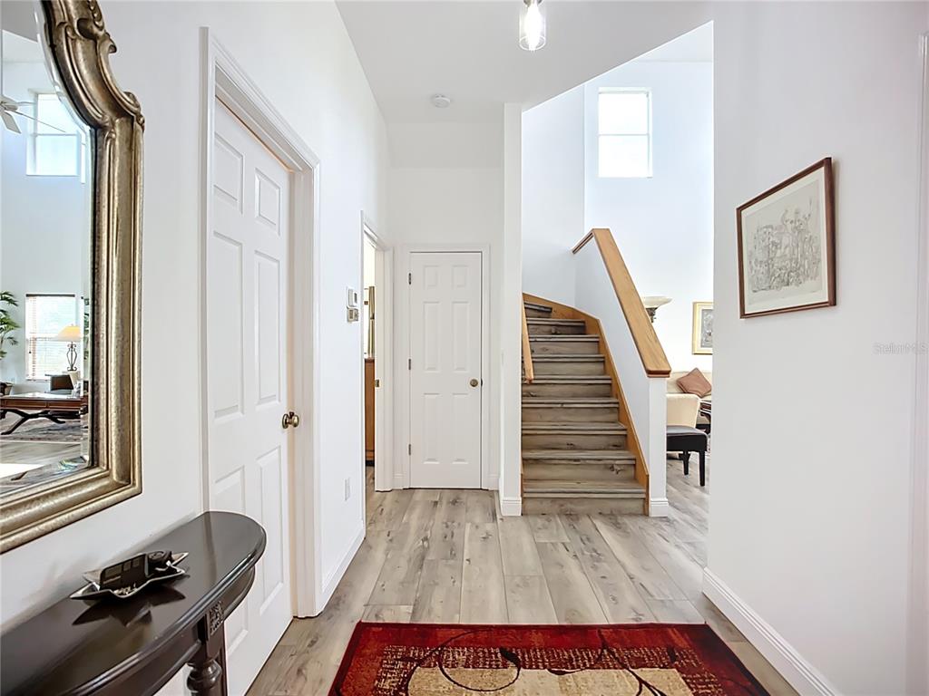 2424 69th Avenue West, Unit 2424 Bradenton, FL 34207 - Photo 19 of 49 a hallway with furniture and wooden floor