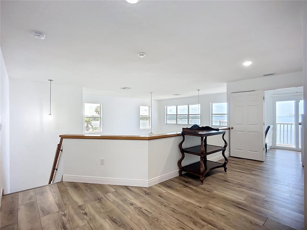 2424 69th Avenue West, Unit 2424 Bradenton, FL 34207 - Photo 22 of 49 a view of a livingroom with furniture and wooden floor