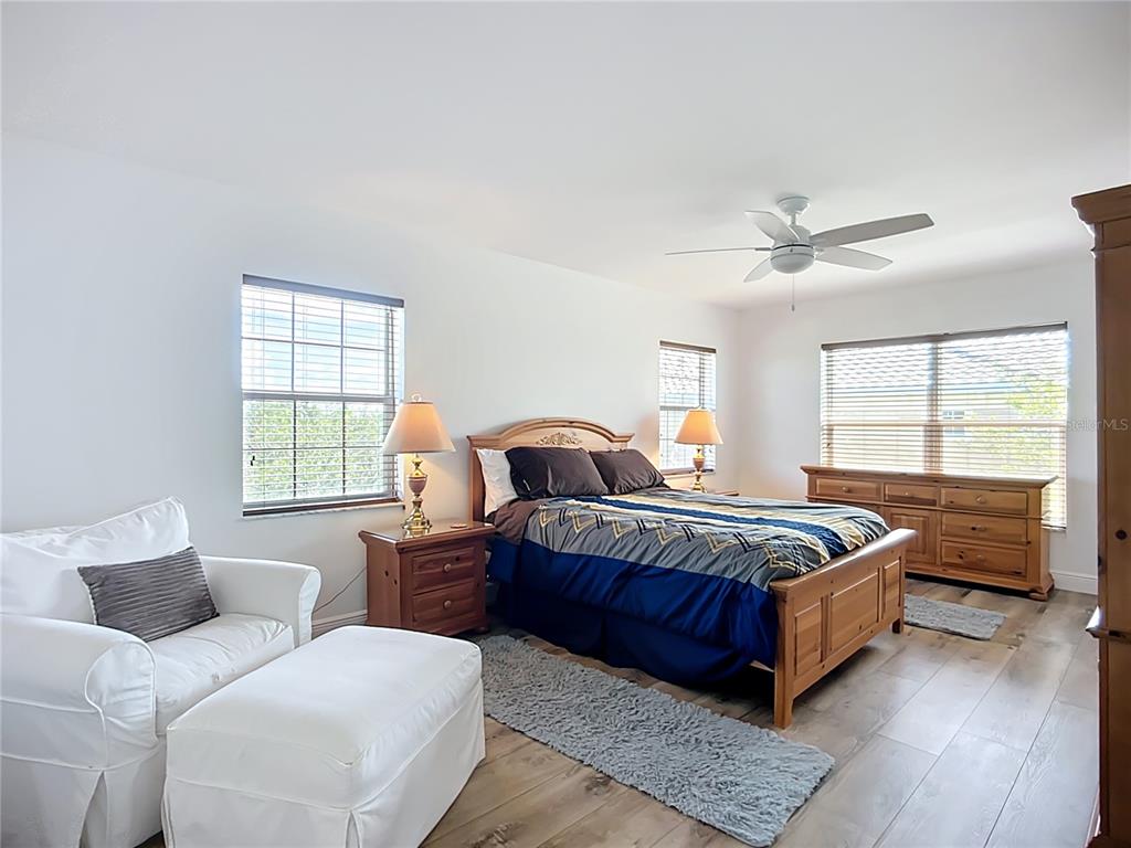 2424 69th Avenue West, Unit 2424 Bradenton, FL 34207 - Photo 29 of 49 a spacious bedroom with a bed and window