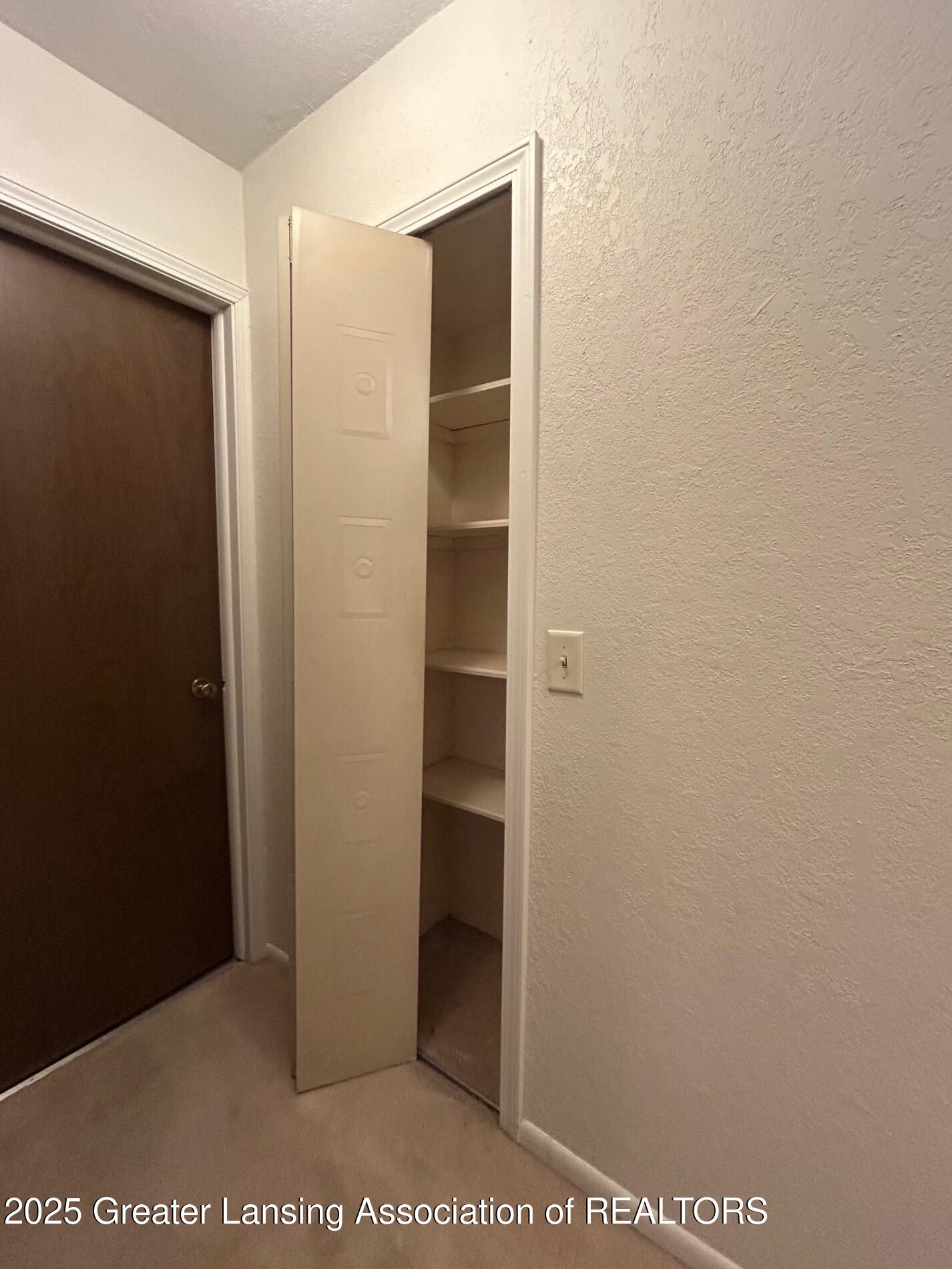 1717 Maple Ridge Road, Unit 49 Haslett, MI 48840 - Photo 16 of 23 Linen closet