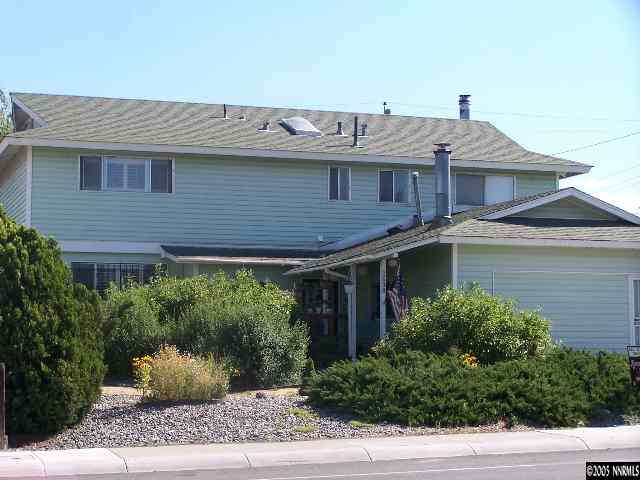 2698 West 7th Street Reno, NV 89503 - Photo 1 of 1 a view of a house with entrance stairs and potted plants