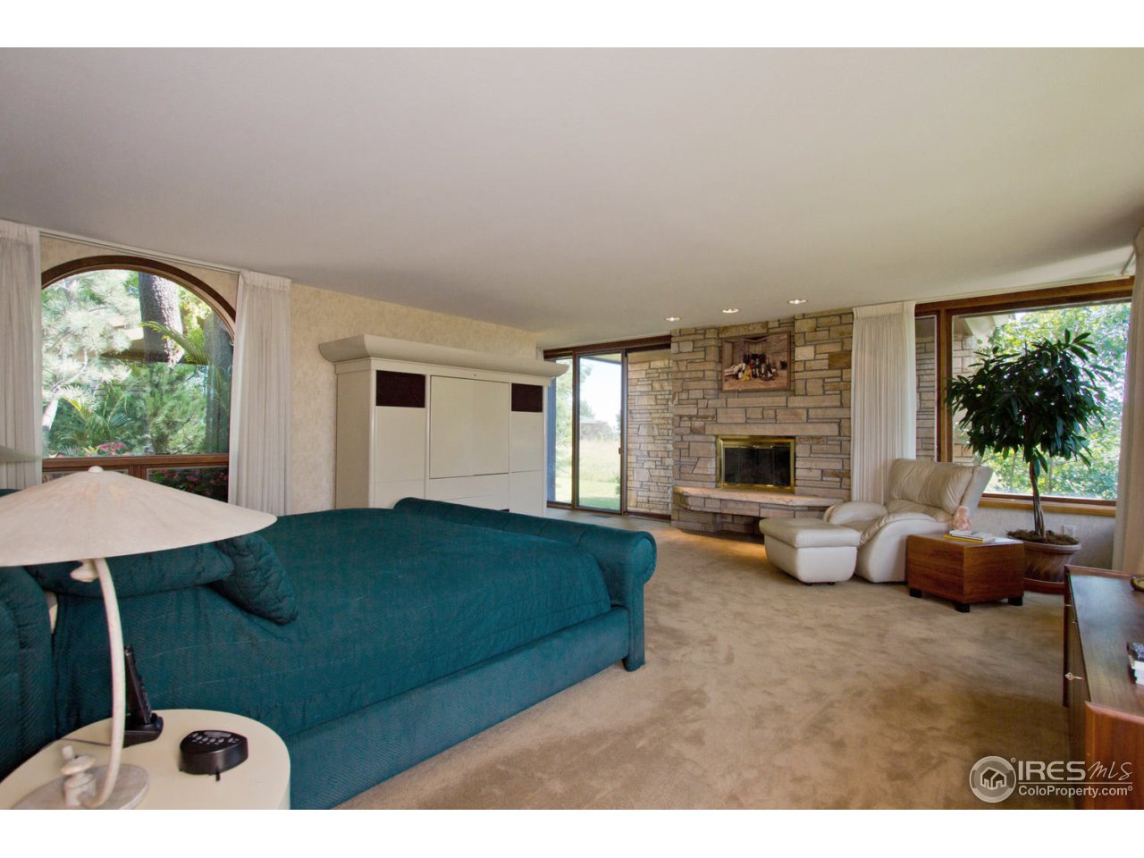 8818 West Phillips Road Boulder, CO 80301 - Photo 16 of 25 a living room with furniture and a fireplace