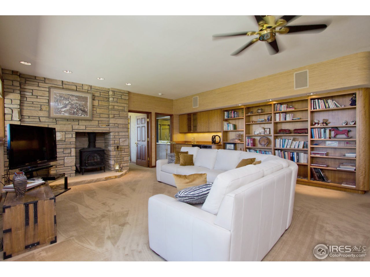 8818 West Phillips Road Boulder, CO 80301 - Photo 19 of 25 a living room with furniture and a flat screen tv