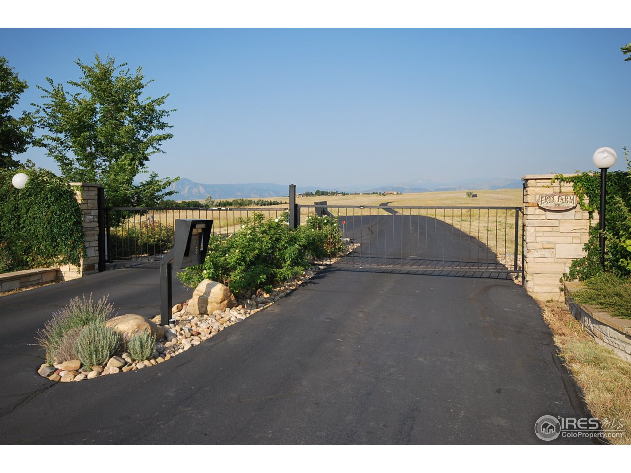 8818 West Phillips Road Boulder, CO 80301 - Photo 2 of 25 a view of a lake with a outdoor space