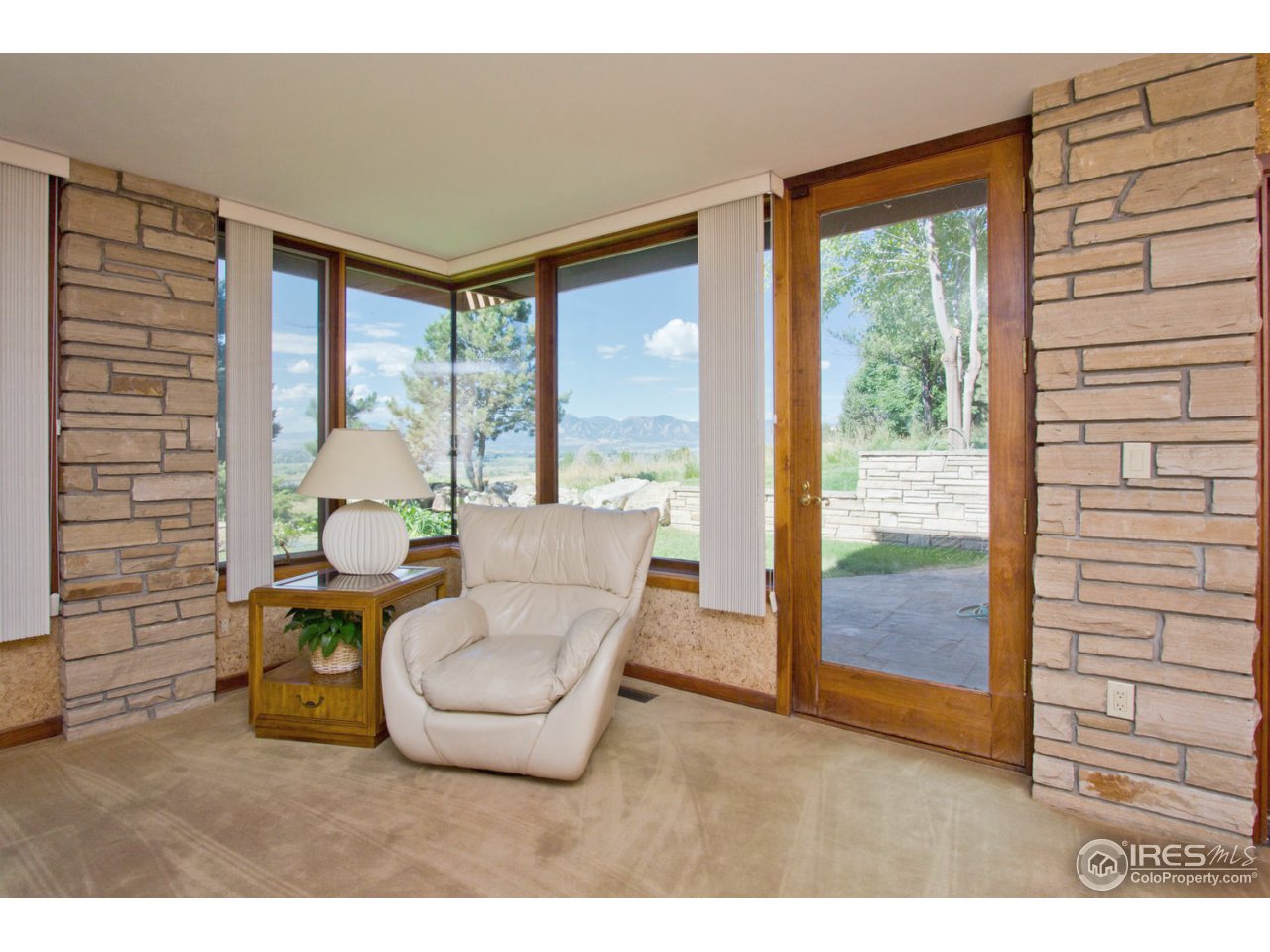 8818 West Phillips Road Boulder, CO 80301 - Photo 21 of 25 a living room with furniture and a window