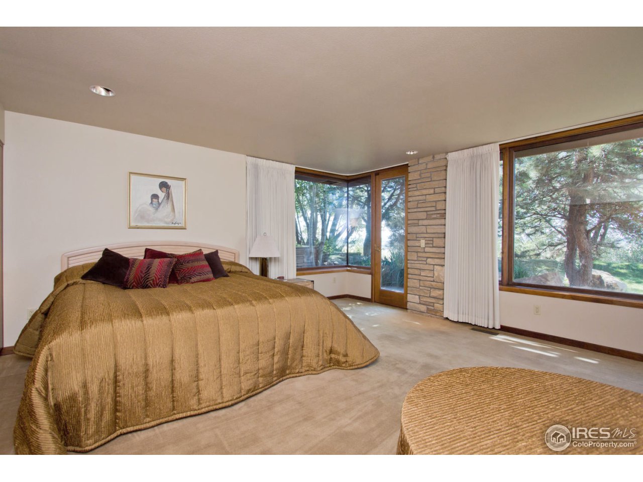 8818 West Phillips Road Boulder, CO 80301 - Photo 22 of 25 a spacious bedroom with a bed and a large window