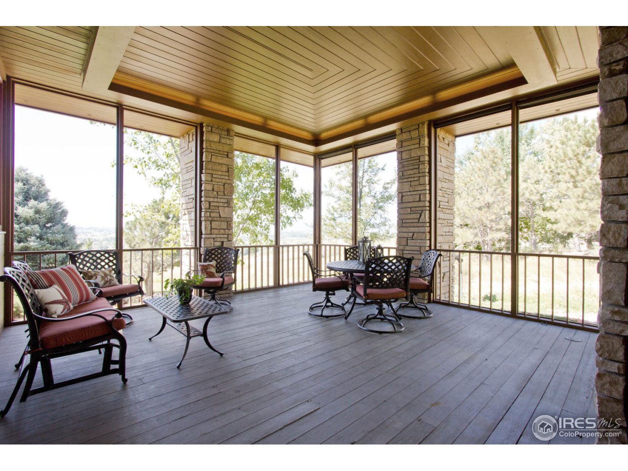 8818 West Phillips Road Boulder, CO 80301 - Photo 23 of 25 a living room with furniture and floor to ceiling windows