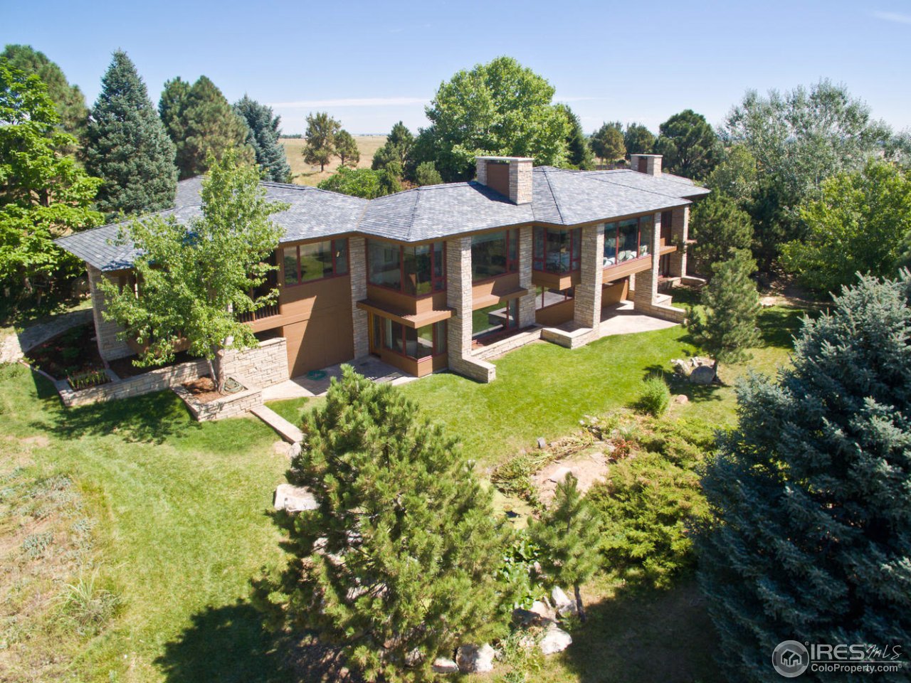 8818 West Phillips Road Boulder, CO 80301 - Photo 25 of 25 a view of a house with backyard and sitting area