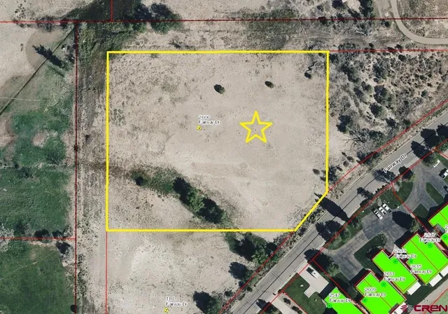 an aerial view of a house with a swimming pool