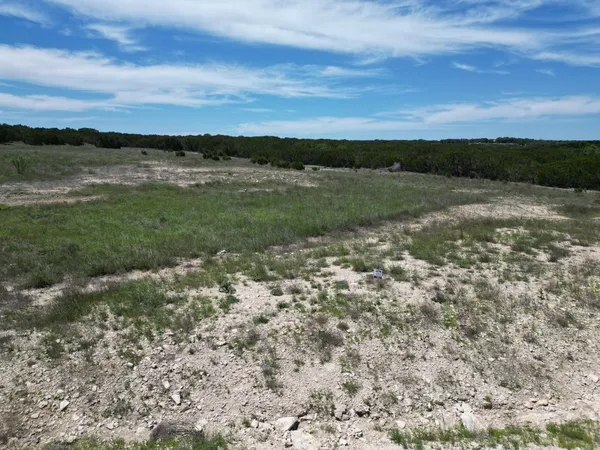 a view of a lake with houses in the back