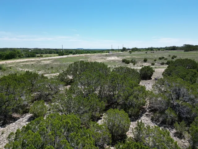 a view of a lake with houses in the back