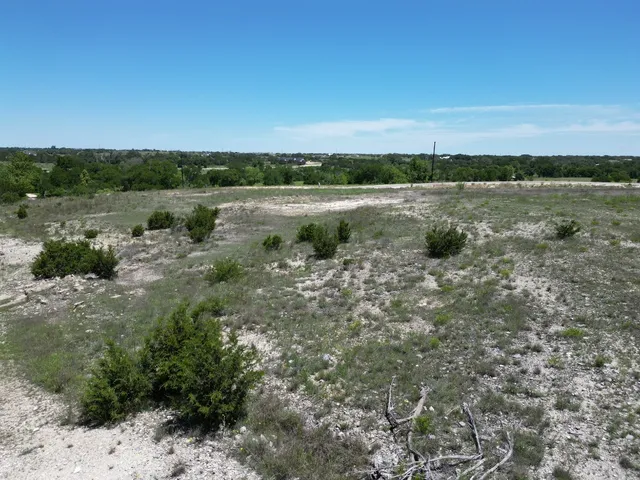 a view of a lake with houses in the back