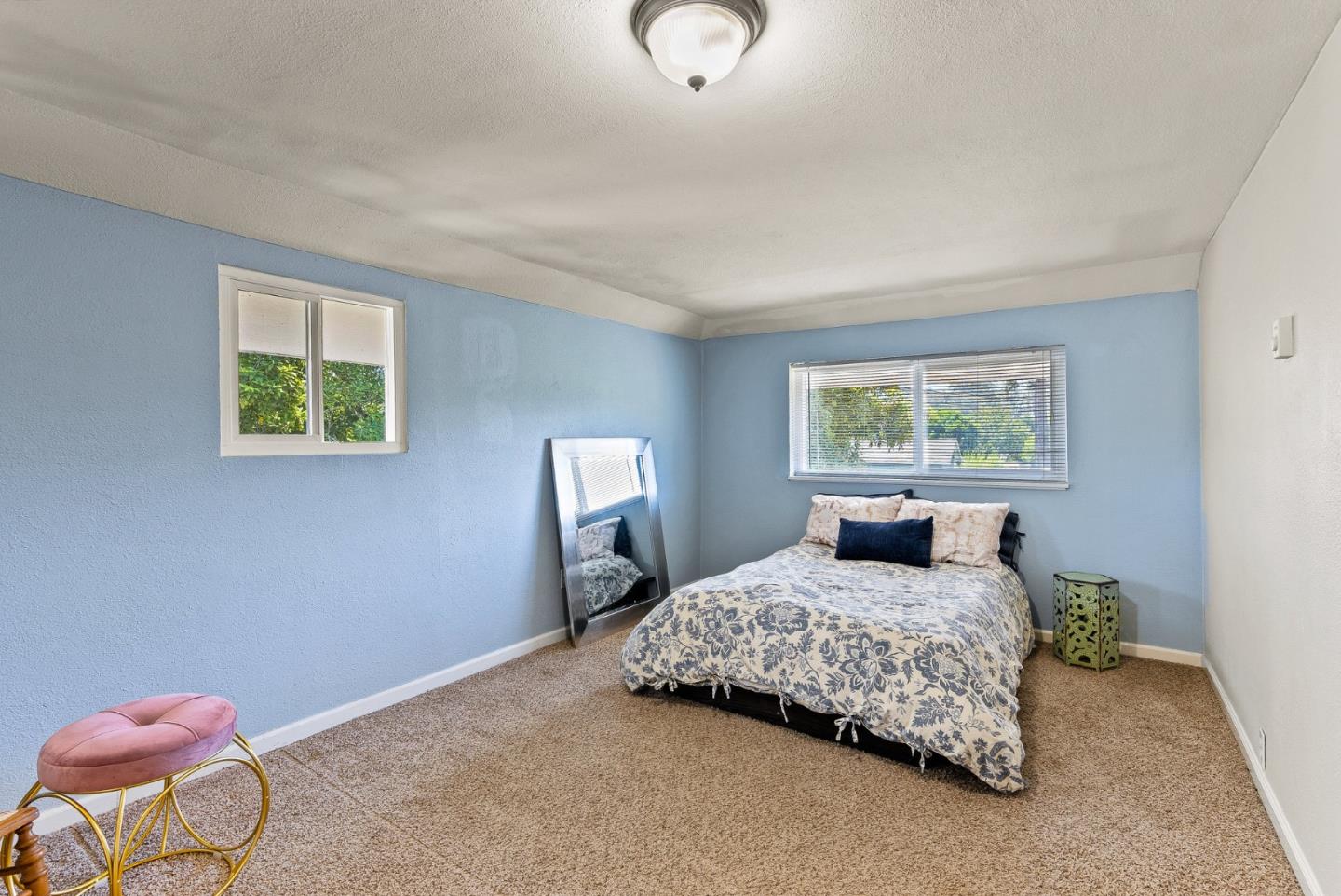 129 Browns Valley Road, Unit A Watsonville, CA 95076 - Photo 15 of 45 a bedroom with a bed and window
