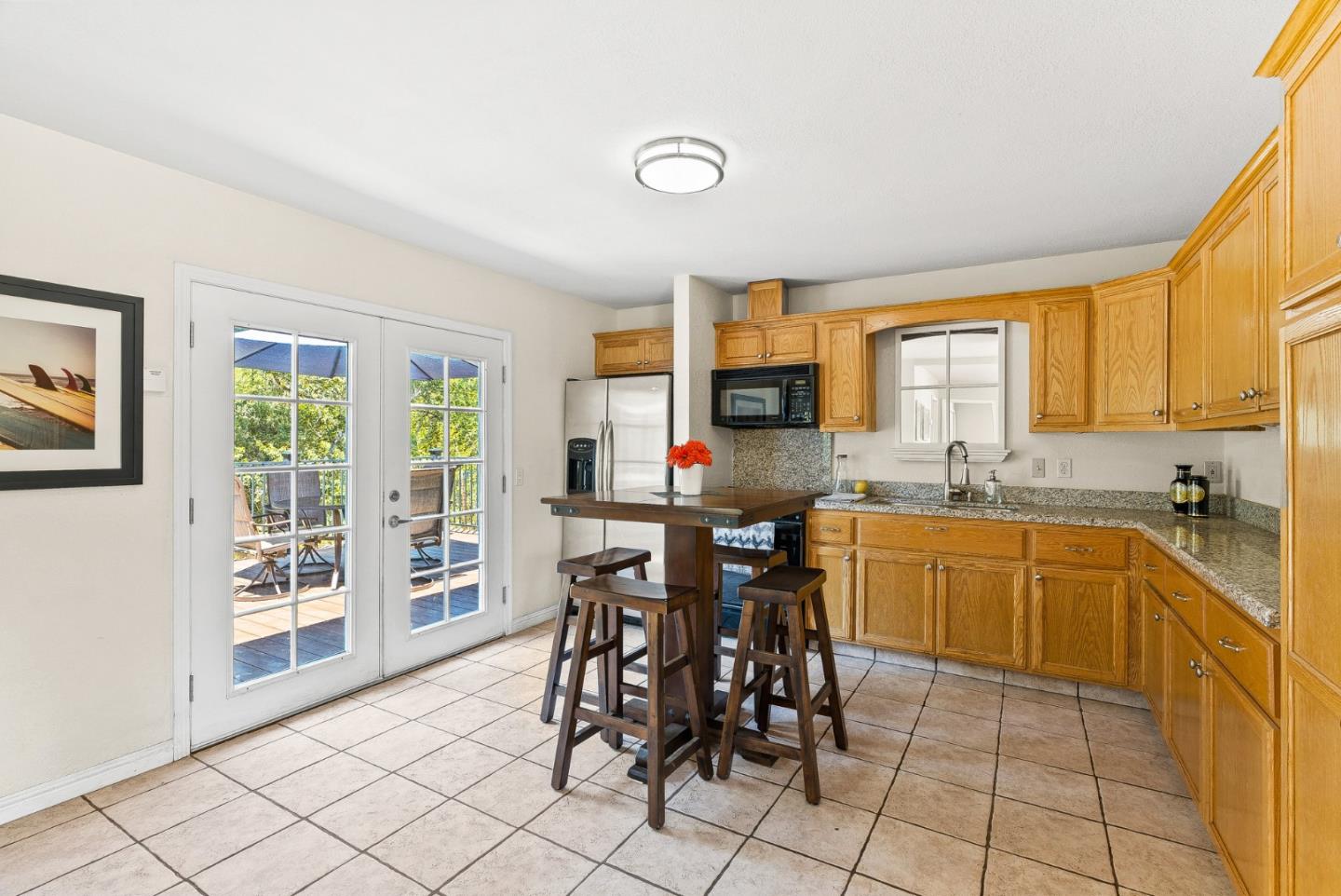 129 Browns Valley Road, Unit A Watsonville, CA 95076 - Photo 24 of 45 a kitchen with granite countertop a sink cabinets and stainless steel appliances