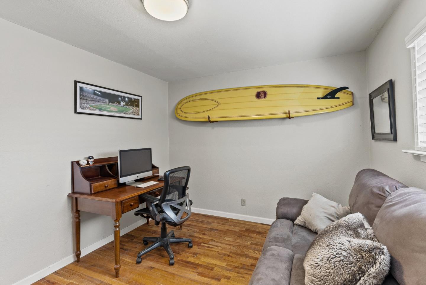 129 Browns Valley Road, Unit A Watsonville, CA 95076 - Photo 27 of 45 a workspace with furniture and wooden floor