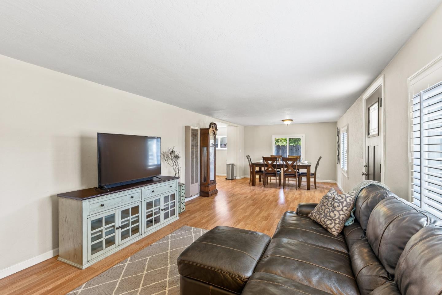 129 Browns Valley Road, Unit A Watsonville, CA 95076 - Photo 6 of 45 a living room with furniture and a flat screen tv