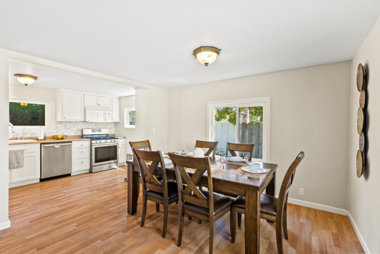 129 Browns Valley Road, Unit A Watsonville, CA 95076 - Photo 7 of 45 a view of a dining room with furniture and wooden floor