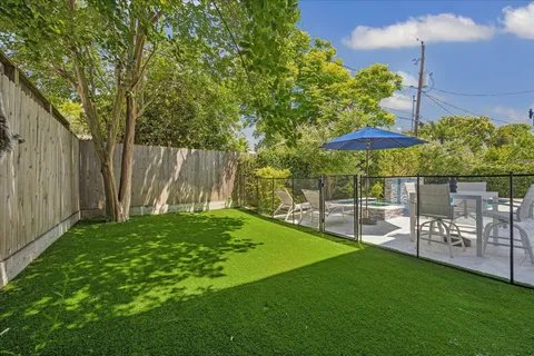 a view of a backyard with a patio
