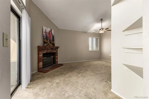 a kitchen with stainless steel appliances granite countertop a sink a refrigerator and cabinets